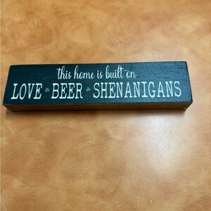 Black Wooden Sign with Saint Patrick’s Day Text